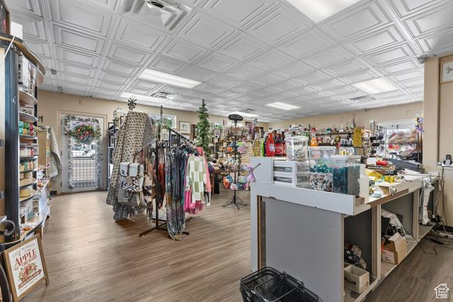 Miscellaneous room featuring wood finished floors and an ornate ceiling | Image 12