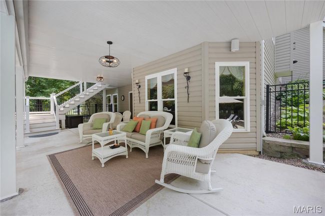 View of patio / terrace featuring stairs and an outdoor hangout area | Image 65