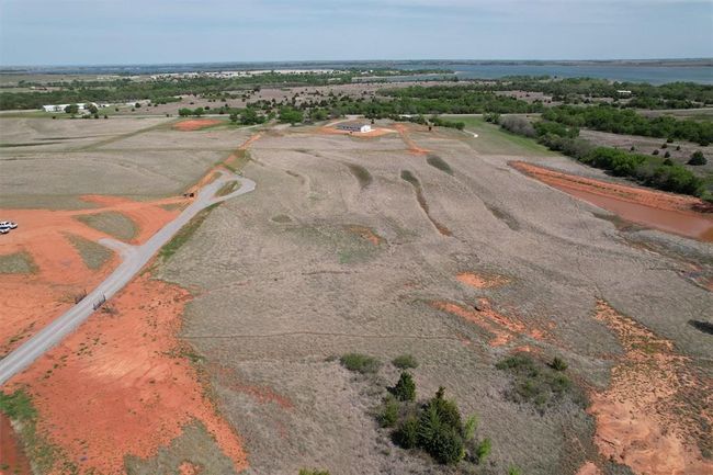 Aerial view of property's location with a nearby body of water | Image 21