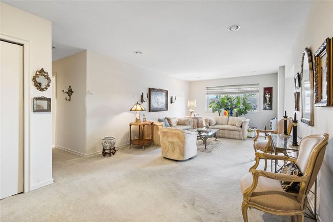 Carpeted living room with baseboards | Image 16