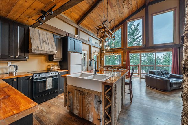 South side kitchen to living and dining with custom features | Image 44