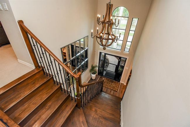 View from the upstairs hallway looking down to the entry. | Image 31