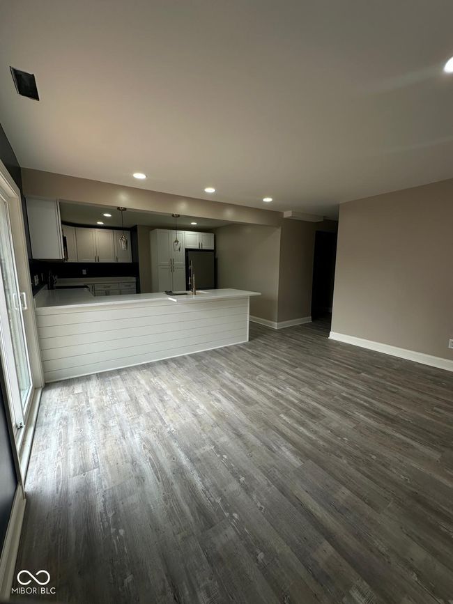 Unit 2 - unfurnished living room featuring dark wood-type flooring and recessed lighting | Image 19