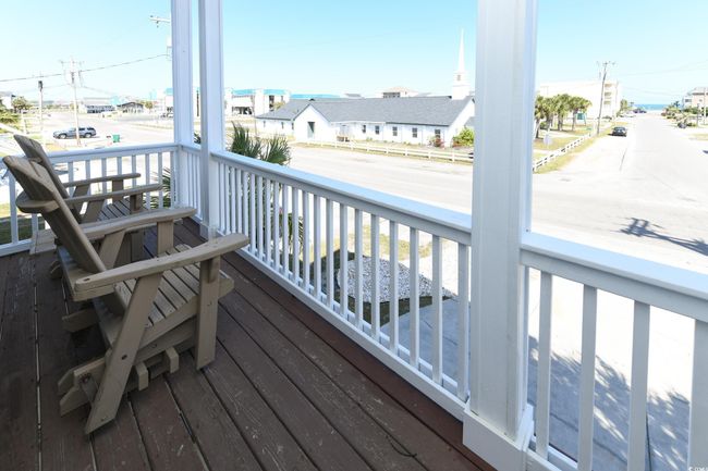 Wooden deck featuring covered porch and a residential view | Image 23