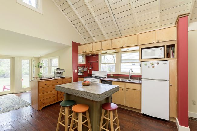 The kitchen is open and airy, with the island at the center! | Image 8