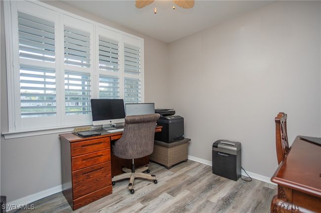 Office with ceiling fan, wood finished floors, and baseboards | Image 10