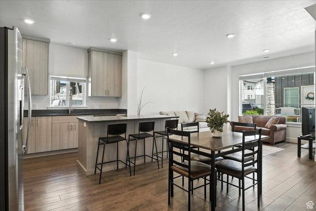 Dining space with dark wood finished floors and recessed lighting | Image 4