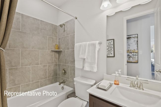 Full bathroom featuring toilet, vanity, and bathing tub / shower combination | Image 18