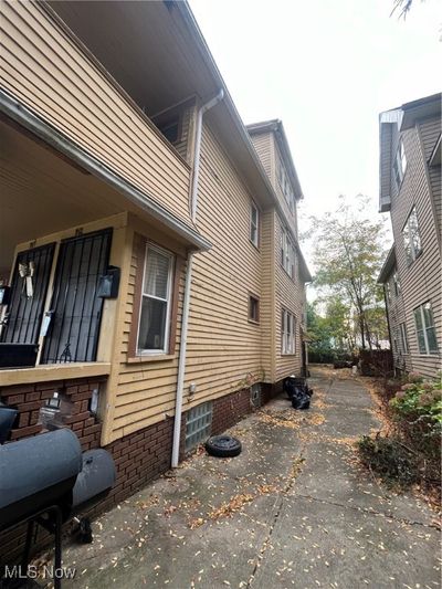 View of home's exterior with central AC and a patio area | Image 3