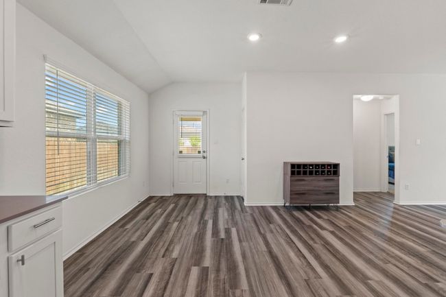 The dining area provides access to the covered patio and back yard. | Image 9