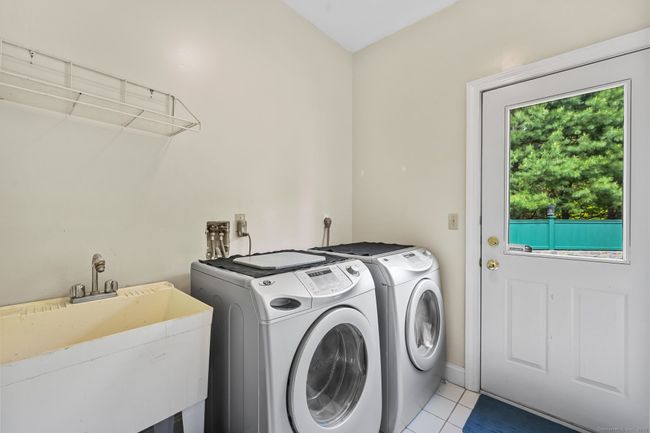 First Floor Laundry Room Off of the Kitchen with Access to the Bluestone Terrace. | Image 14