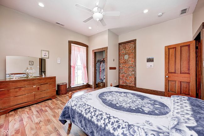 bedroom featuring visible vents, ceiling fan, light wood-type flooring, and recessed lighting | Image 42