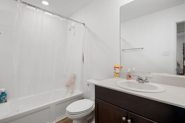 Bathroom featuring shower / bath combo, vanity, and toilet | Image 16