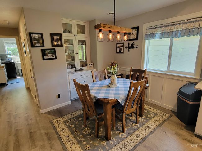 Dining area with light wood-type flooring | Image 11