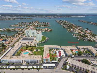 Area View of complex. Pool #1, Unit location, carport location, Pool #2, and fishing pier. | Image 2