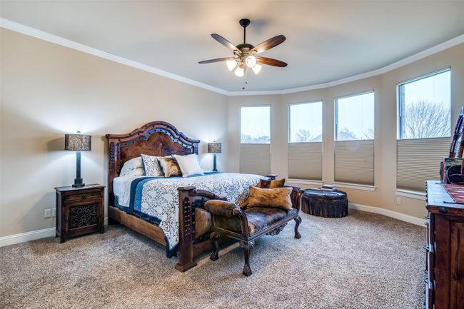 Serenity primary bedroom with large bay windows covered with adjustable shades. There is plenty of room for a sitting area. | Image 20