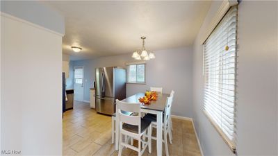 Dining space featuring a chandelier | Image 3