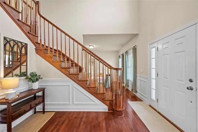 Step inside to find a grand 2 story foyer highlighted by stunning hardwood floors. | Image 7