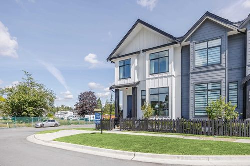 Modern farmhouse style home with fenced yard and durable Hardi Plank - board and batten siding | Card Image