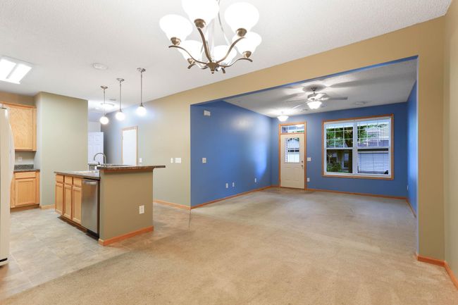 view of living room and kitchen from dining area | Image 9