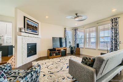 Inviting and cozy space featuring all day sunlight and fireplace. | Image 2