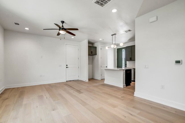 Unfurnished living room featuring recessed lighting, ceiling fan, baseboards, and light wood-type flooring | Image 8