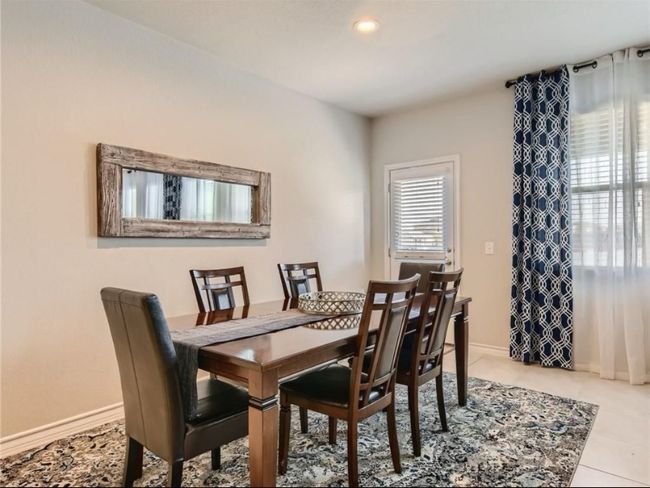 Dining space with recessed lighting and tile patterned floors | Image 14