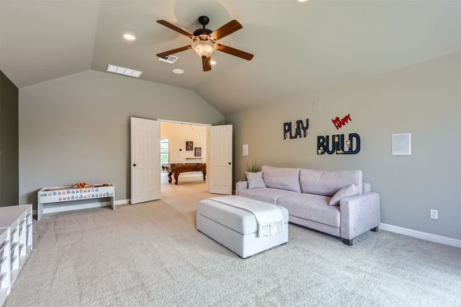 Connected upstairs game and play/media rooms offer space for everyone to do their own thing. | Image 26