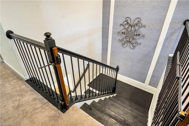 Stairwell with custom stairs and railing. | Image 34