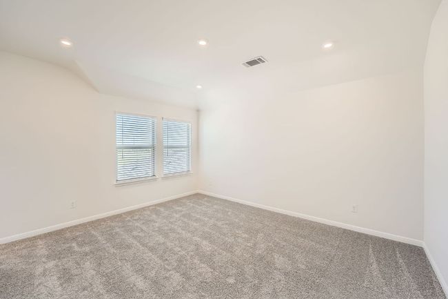 Carpeted empty room featuring recessed lighting, visible vents, and baseboards | Image 14