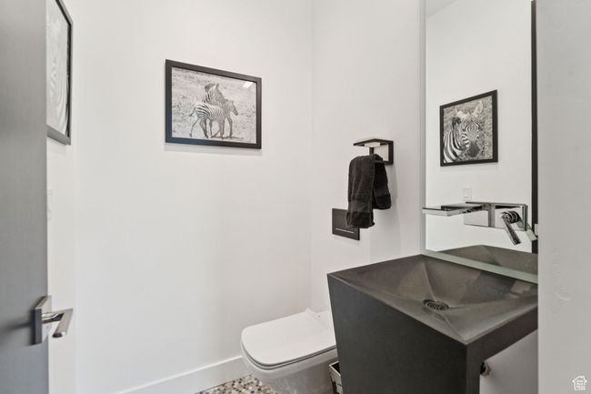Half bathroom featuring toilet and vanity | Image 30