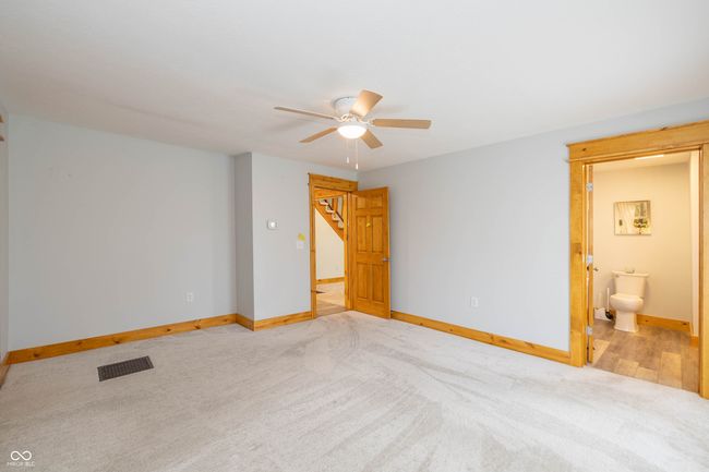 unfurnished bedroom with visible vents, baseboards, and carpet | Image 6