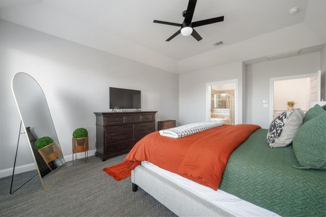 Fresh and modern, the primary bedroom is the best place to begin and end your day. | Image 24