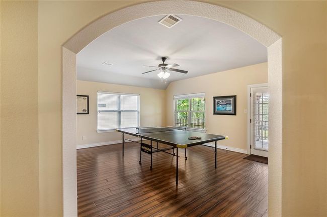 The view of the charismatic game room that has access to the charming oversized front balcony. | Image 27