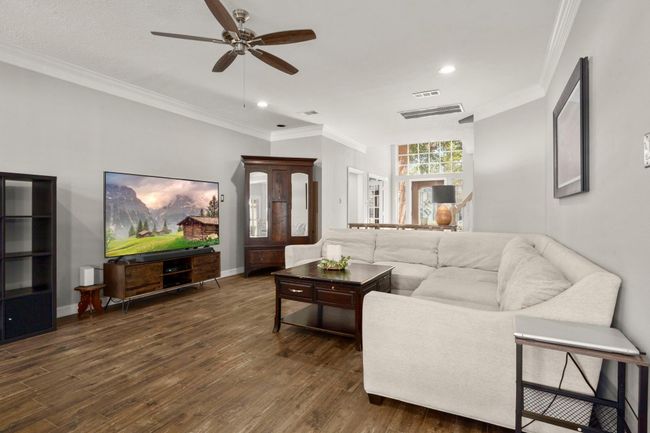 Family room easily accommodates your oversized sectional. | Image 12