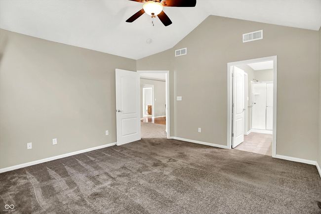 Spacious Primary Bedroom with high vaulted ceiling, and a ceiling fan | Image 17