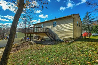 Rear view of house featuring a yard and a deck | Image 3