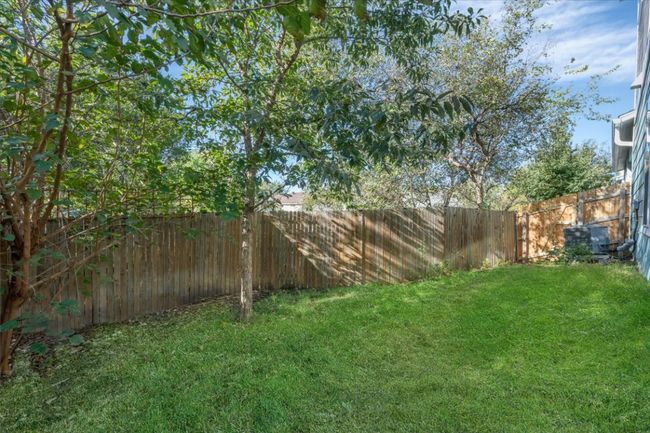 The unit has a private, fenced yard to enjoy. | Image 7