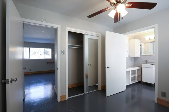 Unfurnished bedroom featuring a closet, a ceiling fan, and connected bathroom | Image 17