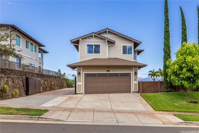 Front view of home with extended paved, gated driveway. Great for extra cars or a boat. Gate securely locks with key. | Image 3