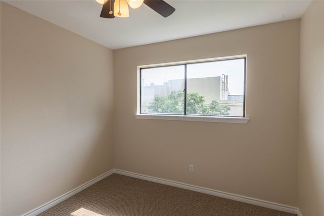 Spare room with carpet flooring, a ceiling fan, and baseboards | Image 27