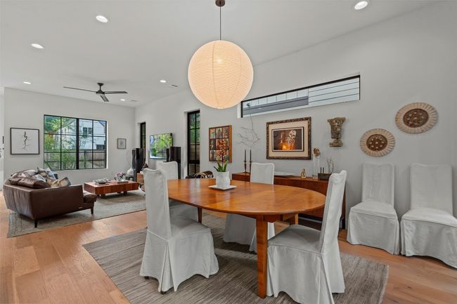 Dining area featuring light wood finished floors, recessed lighting, and a ceiling fan | Image 11
