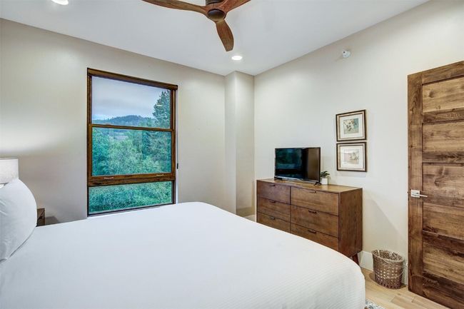 Bedroom featuring recessed lighting, ceiling fan, wood finished floors, and baseboards | Image 22