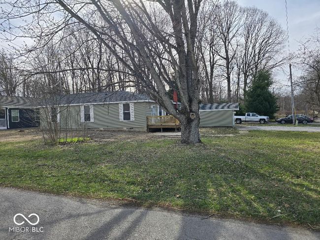 exterior space with a deck, a yard, and crawl space | Image 9