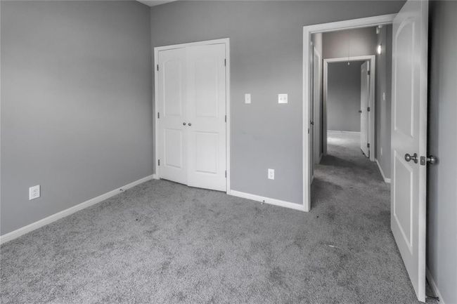The view from the front secondary bedroom into the hallway. | Image 14