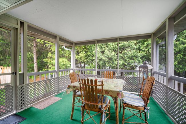 Kick Back and Relax in Your Screened-In Porch with Cedar Privacy Backdrop! | Image 18