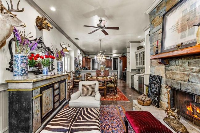 Living area adjacent to the dining and kitchen area enjoys an open feel. It is a great place to relax with a brandy and enjoy the bay views after dinner. | Image 19