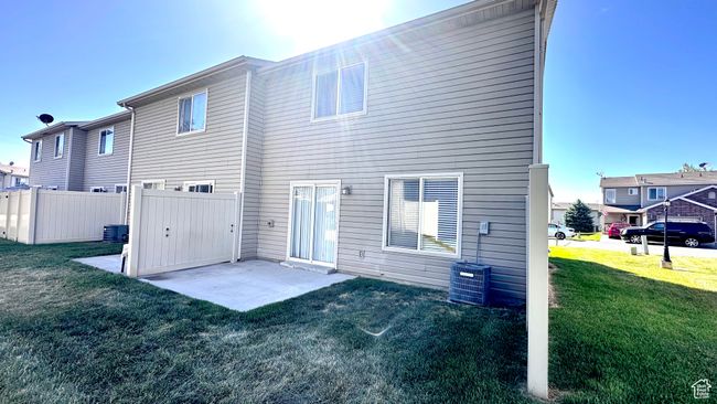 Rear view of property with a patio and central air condition unit | Image 22