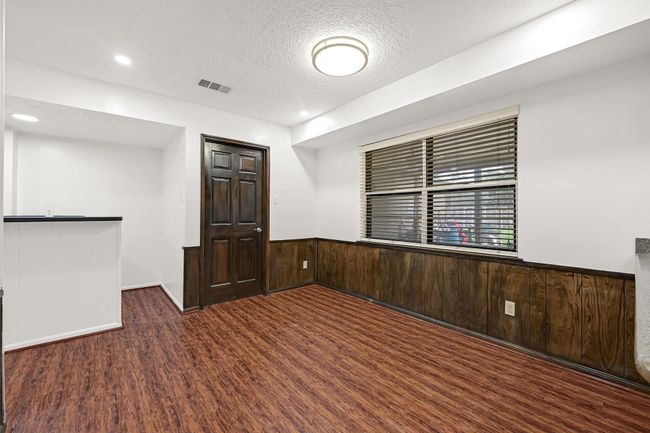 View of the formal dining and entrance to the wet bar. | Image 17