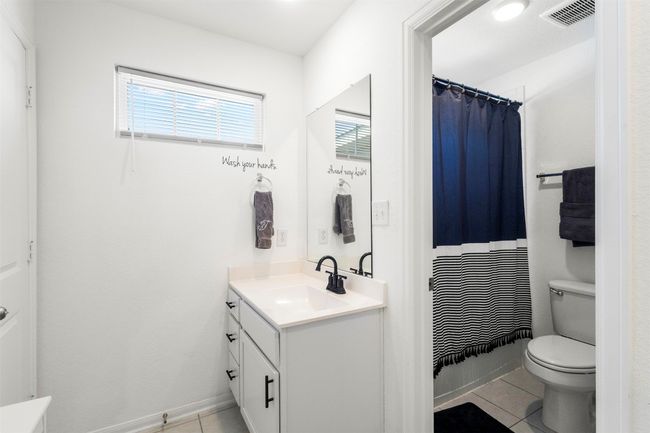 Full bathroom featuring tile floors, vanity | Image 23